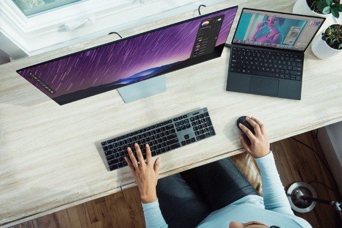 person working in tidy workstation