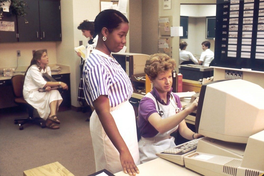 Nurses looking at a Computer